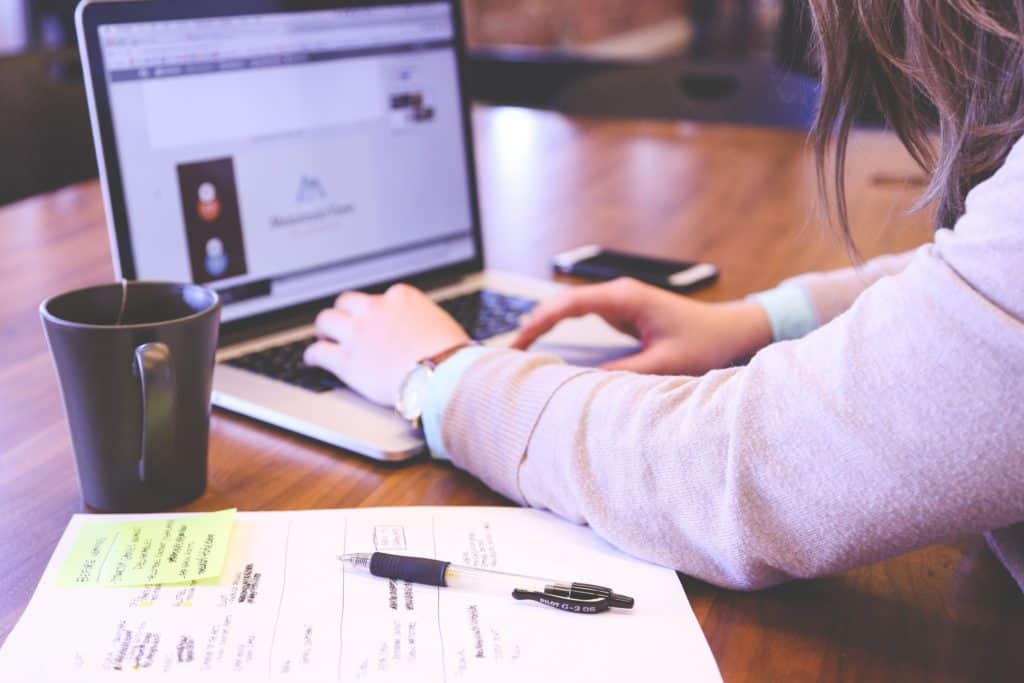 Woman Using Computer At Work