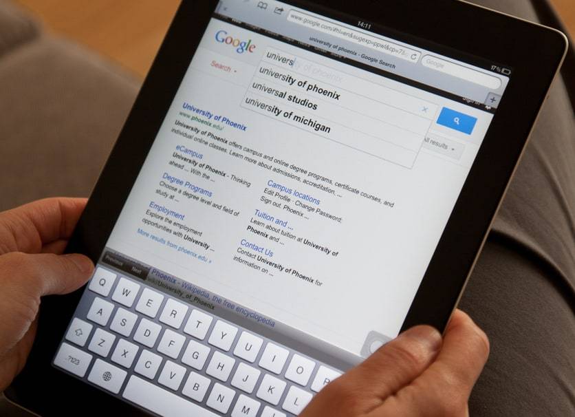 Ankara, Turkey - November 14, 2011: Female hand holding iPad 2 showing a google search results. The iPad 2 is a tablet computer produced by Apple Inc. Google Inc is an American multinational public corporation invested in Internet search, cloud computing, and advertising technologies. SEO